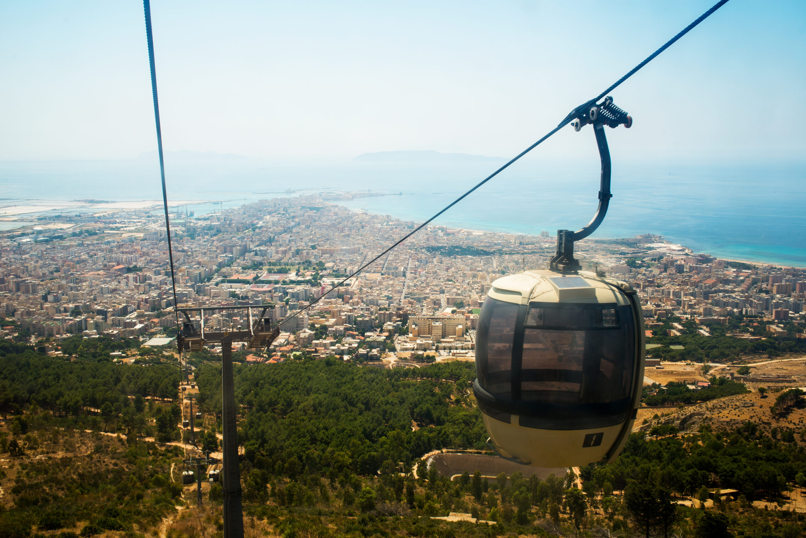 Erice, Italy - July 15, 2015: Landscape of Trapani city from the cableway of Erice.
Cable cars climb to the village of Erice.
The cableway is one of best mean to reach the summit of Erice village.
Erice, province of Trapani. Sicily, Italy.